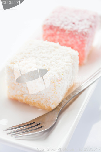 Image of Close up lamington sponge cakes and fork