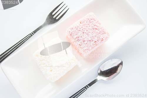 Image of Pink and white lamington sponge cakes 