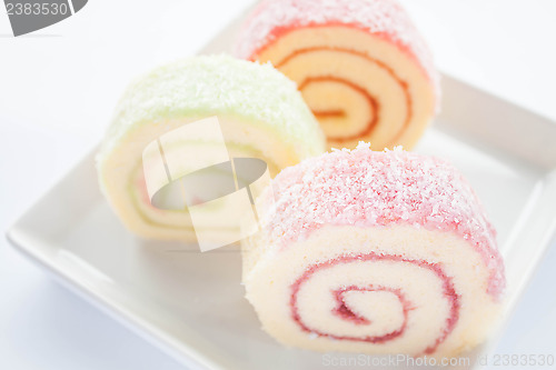 Image of Colorful jam roll cakes  on white background 