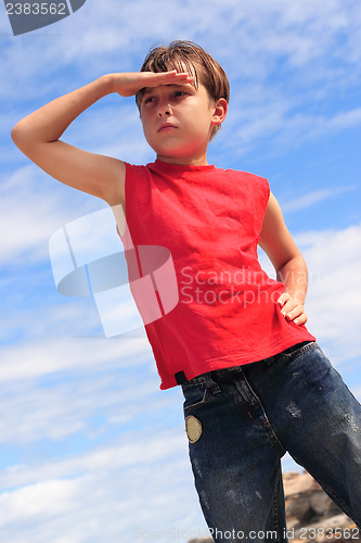 Image of Boy searching looking hand to forehead