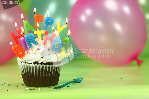 Image of Celebration with Balloons Candles and Cake