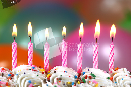 Image of Celebration with Balloons Candles and Cake