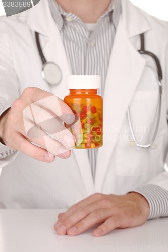 Image of Doctor With Medication in Prescription Bottles