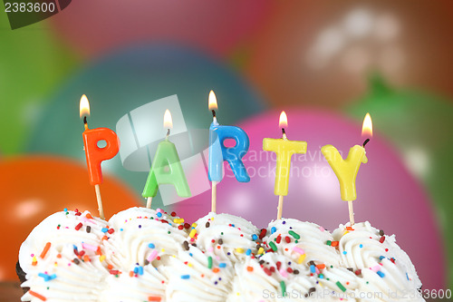 Image of Celebration with Balloons Candles and Cake