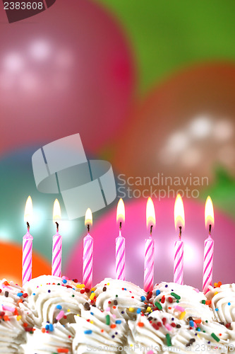 Image of Celebration with Balloons Candles and Cake