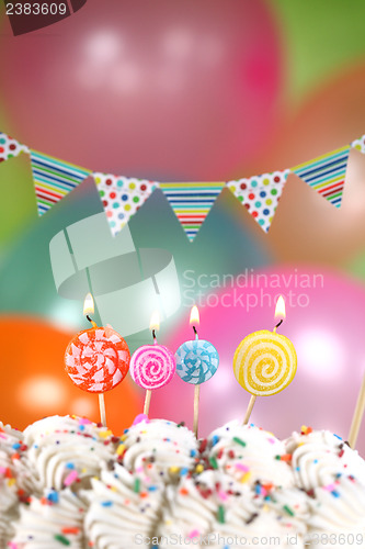 Image of Celebration with Balloons Candles and Cake