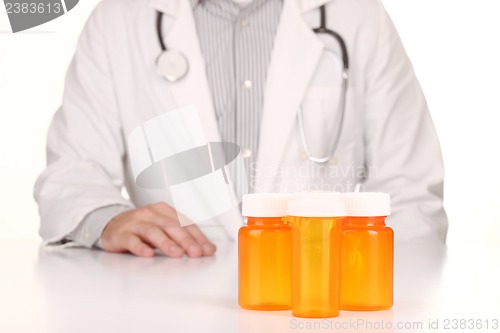 Image of  Doctor With Empty Orange Prescription Bottles