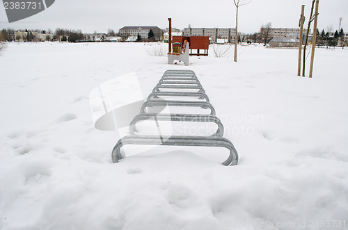 Image of bicicle parking place snow park lake beach winter 