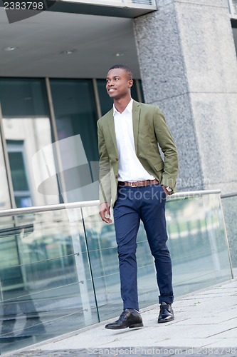 Image of young successful african business man outdoor in summer