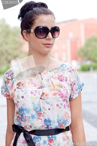 Image of attractive woman with sunglasses in the city summertime