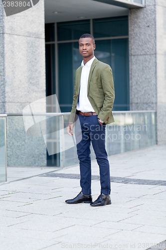 Image of young successful african business man outdoor in summer