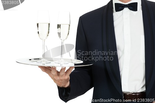 Image of adult male waiter serving two glass of champagne isolated