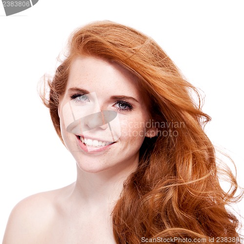 Image of beautiful young redhead woman with freckles portrait