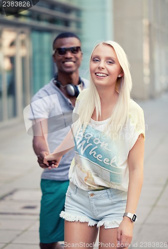 Image of happy young couple have fun in the city summertime 