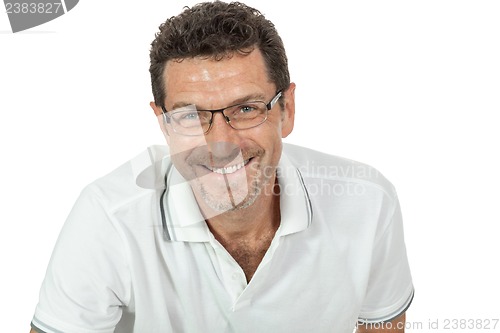 Image of attractive healthy adult man sitting on floor with jeans isolated