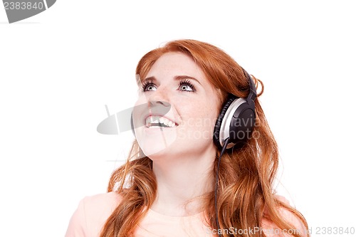 Image of attractive happy woman with headphones listen to music isolated