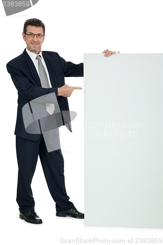 Image of mature smiling businessman holding billboard copyspace isolated