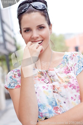 Image of attractive woman with sunglasses in the city summertime