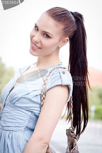 Image of young attraktive happy woman outdoor in summer