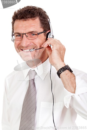 Image of smiling mature male operator businessman with headset call senter