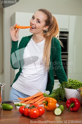 Image of young woman cooking vegetarian food