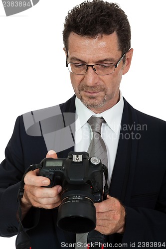 Image of adult man photographer with digital camera dslr isolated