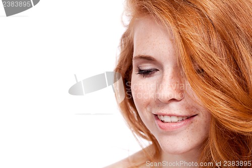 Image of beautiful young redhead woman with freckles portrait