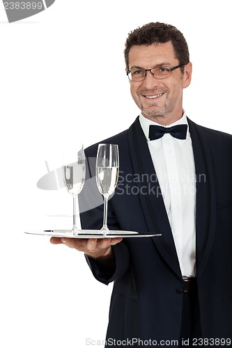 Image of adult male waiter serving two glass of champagne isolated