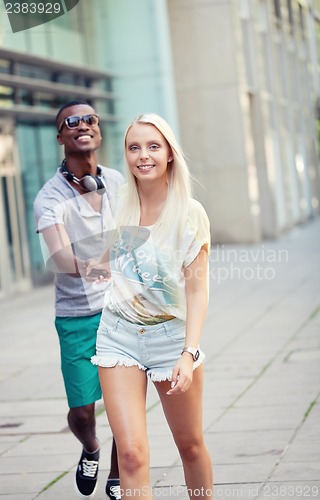 Image of happy young couple have fun in the city summertime 
