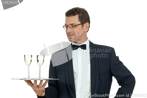 Image of adult male waiter serving two glass of champagne isolated