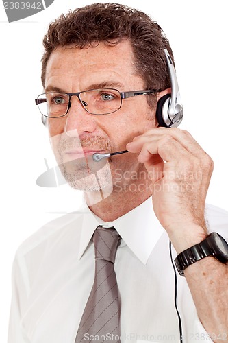 Image of smiling mature male operator businessman with headset call senter