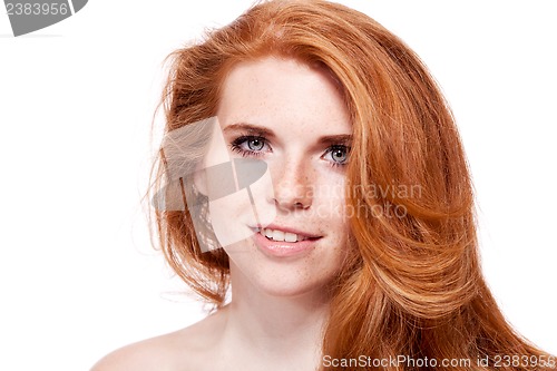 Image of beautiful young redhead woman with freckles portrait