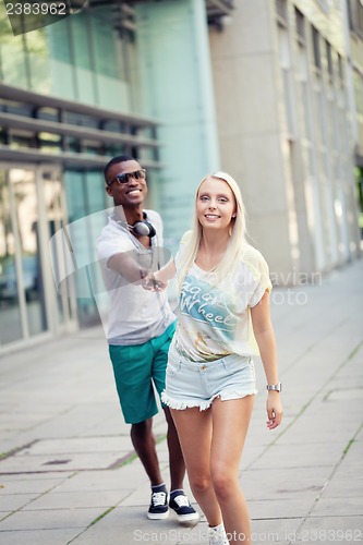 Image of happy young couple have fun in the city summertime 