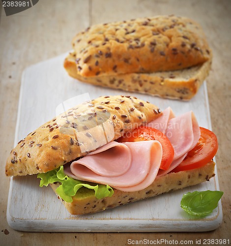 Image of sandwich with ham and tomatoes