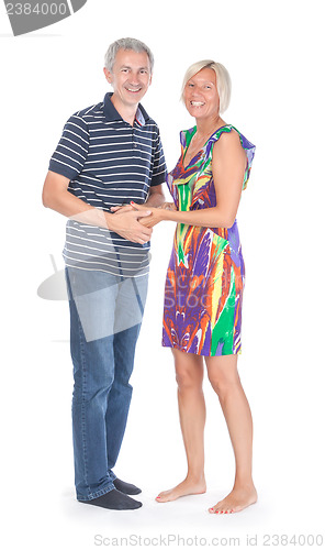 Image of Smiling attractive middle-aged couple