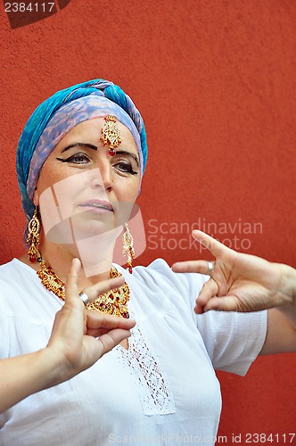 Image of  woman with Indian necklace, earrings and tikka