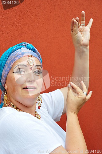 Image of beautiful blond senior woman with Indian jewleries