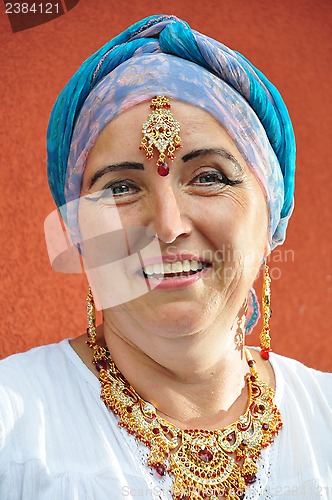 Image of beautiful blond senior woman with Indian jewleries