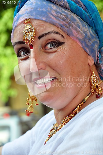 Image of  senior woman with Indian jewlery in the street