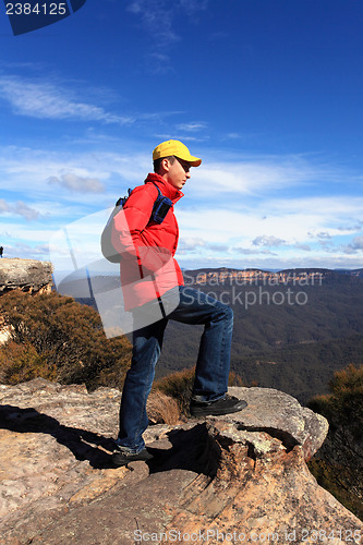 Image of Bushwalker hiker looking out over mountain valley views