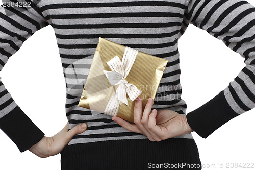 Image of Young woman holding a present