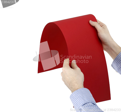 Image of Hand holdong a paper.