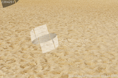 Image of yellow sea sand with footprints