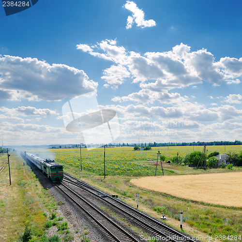 Image of old locomotive with train on railroad