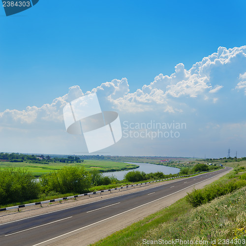 Image of road under cloudy sky