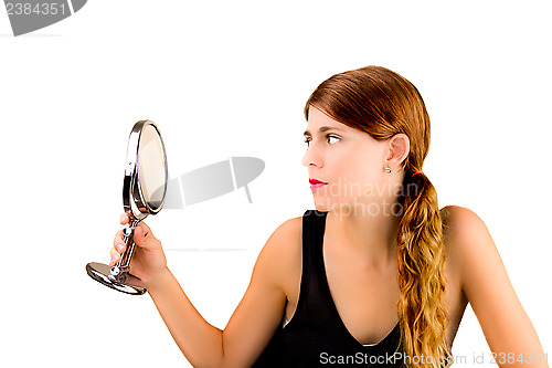 Image of Checking herself in the mirror