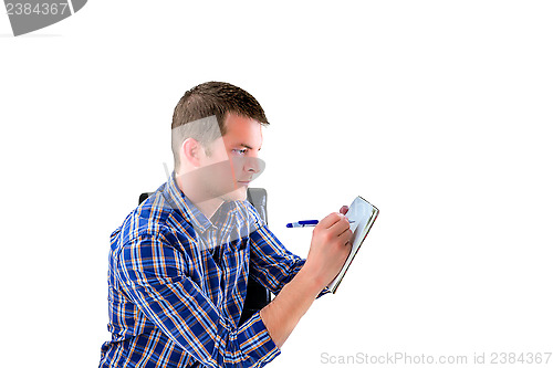 Image of Man preparing a list