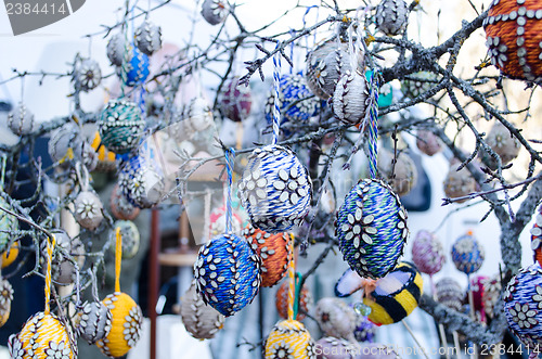 Image of handmade easter eggs hang tree branch spring fair 