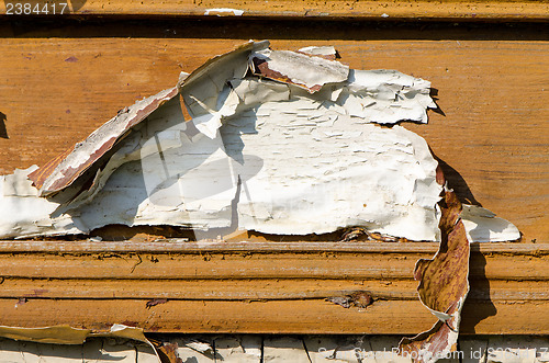 Image of abandoned rural wooden wall peeled paint backdrop 