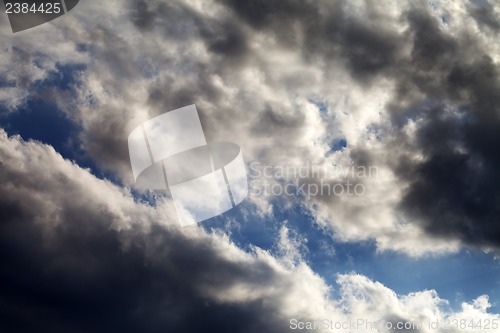 Image of Blue sky with dark clouds